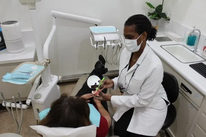 Cheryl providing personalized dental hygiene education to a patient
